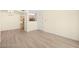 Bright living space with views of the kitchen and access to the front door at 7885 W Flamingo Rd # 1131, Las Vegas, NV 89147