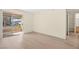 Bright living room with sliding glass door to patio and views of community at 7885 W Flamingo Rd # 1131, Las Vegas, NV 89147
