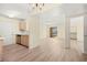 Bright living room with sliding glass doors leading to balcony and open to adjacent kitchen at 7885 W Flamingo Rd # 1131, Las Vegas, NV 89147