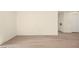 Bright living room features light wood flooring and white walls and trim at 7885 W Flamingo Rd # 1131, Las Vegas, NV 89147