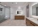 Modern bathroom with a glass-enclosed shower and double vanity at 794 Willits St, Las Vegas, NV 89138