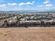 Wide aerial view of condo complex featuring the cityscape and desert landscape at 8070 W Russell Rd # 1023, Las Vegas, NV 89113