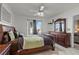 Comfortable bedroom featuring a classic wooden bed frame and ample storage at 8070 W Russell Rd # 1023, Las Vegas, NV 89113