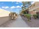 Exterior walkway featuring natural light and mature landscaping at 8070 W Russell Rd # 1023, Las Vegas, NV 89113