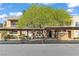 Condo exterior featuring covered parking, manicured landscaping, and natural light at 8070 W Russell Rd # 1023, Las Vegas, NV 89113