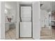 Convenient laundry area with stacked washer and dryer near bathroom at 8070 W Russell Rd # 1023, Las Vegas, NV 89113