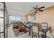 Comfortable living room with a ceiling fan, patio access, and a dining table at 8070 W Russell Rd # 1023, Las Vegas, NV 89113