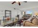 Spacious living room featuring neutral colors and a glass table, with access to an outdoor patio at 8070 W Russell Rd # 1023, Las Vegas, NV 89113