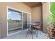 Charming patio with table, chairs and view to the living room at 8070 W Russell Rd # 1023, Las Vegas, NV 89113