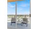 Balcony with comfortable seating and expansive views, accessible through sliding glass doors at 8255 Las Vegas Blvd # 722, Las Vegas, NV 89123