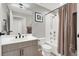 Clean bathroom with a single vanity, tub shower with curtain, and coordinated accessories at 8255 Las Vegas Blvd # 722, Las Vegas, NV 89123