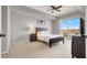 Comfortable bedroom with a cozy bed, sleek ceiling fan, and a balcony offering picturesque views at 8255 Las Vegas Blvd # 722, Las Vegas, NV 89123