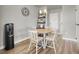 Cozy breakfast nook with round table, chairs, overhead lighting, and decorative shelving at 8255 Las Vegas Blvd # 722, Las Vegas, NV 89123