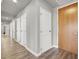 Long hallway with multiple doors showcasing the floor plan and access to various rooms at 8255 Las Vegas Blvd # 722, Las Vegas, NV 89123