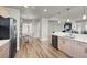 Bright kitchen featuring wood floors, stainless steel appliances, and a view of the breakfast nook and living areas at 8255 Las Vegas Blvd # 722, Las Vegas, NV 89123
