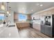 Bright kitchen featuring stainless steel appliances, stylish cabinets, and a well-lit countertop with a large window at 8255 Las Vegas Blvd # 722, Las Vegas, NV 89123