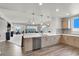 Open kitchen showcasing modern cabinetry, stainless steel appliances, and seamless flow into the dining and living area at 8255 Las Vegas Blvd # 722, Las Vegas, NV 89123