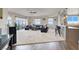 Open-concept living room with plush carpet and floor-to-ceiling windows at 8255 Las Vegas Blvd # 722, Las Vegas, NV 89123