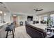 Stylish living area with bar seating, tv and seamless flow into dining at 8255 Las Vegas Blvd # 722, Las Vegas, NV 89123