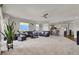 Expansive living room showcasing an open layout to the kitchen and plush carpet at 8255 Las Vegas Blvd # 722, Las Vegas, NV 89123