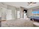 Large main bedroom with a scenic view, ceiling fan, and access to the ensuite bath at 8255 Las Vegas Blvd # 722, Las Vegas, NV 89123