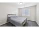 Bright bedroom with a queen-sized bed and carpet flooring at 9238 Bluemist Falls St, Las Vegas, NV 89123