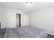 Bedroom features neutral walls, sliding closet, gray carpet, recessed lighting, and natural light at 9238 Bluemist Falls St, Las Vegas, NV 89123