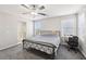 Bright and airy bedroom featuring a ceiling fan and carpet flooring at 9238 Bluemist Falls St, Las Vegas, NV 89123