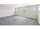 Large bedroom features plush gray carpet, neutral walls, recessed lighting, and natural light at 9238 Bluemist Falls St, Las Vegas, NV 89123