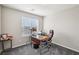Functional office with neutral walls, window with blinds, gray carpet, and ample workspace at 9238 Bluemist Falls St, Las Vegas, NV 89123