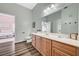 Well-lit bathroom featuring a vanity with a sink and a large mirror at 9303 Gilcrease Ave # 2234, Las Vegas, NV 89149