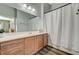 Bathroom featuring a vanity with a sink, a large mirror, and a shower with a curtain at 9303 Gilcrease Ave # 2234, Las Vegas, NV 89149
