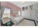 Charming bedroom featuring a pull-out bed, soft colors, and stylish decor at 9303 Gilcrease Ave # 2234, Las Vegas, NV 89149