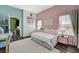 Bright bedroom featuring two windows, a daybed, and a playful color scheme at 9303 Gilcrease Ave # 2234, Las Vegas, NV 89149