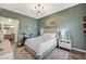 Comfortable bedroom featuring wood-style floors, ensuite bathroom, and modern decor at 9303 Gilcrease Ave # 2234, Las Vegas, NV 89149