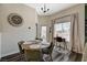 Bright dining area showcases a round table, study nook, and outdoor access to the front entryway at 9303 Gilcrease Ave # 2234, Las Vegas, NV 89149
