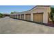 Row of garages with neutral-colored doors provide ample parking for residents at 9303 Gilcrease Ave # 2234, Las Vegas, NV 89149