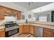 Updated kitchen with stainless appliances, oak cabinetry, and an easy flow into the main living areas at 9303 Gilcrease Ave # 2234, Las Vegas, NV 89149