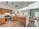 The kitchen area is open to the living area, featuring stainless steel appliances and oak cabinets at 9303 Gilcrease Ave # 2234, Las Vegas, NV 89149