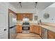 Functional kitchen features stainless steel appliances, oak cabinets, and ample counter space for meal prep at 9303 Gilcrease Ave # 2234, Las Vegas, NV 89149