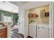 Convenient laundry closet off the kitchen features a stackable washer and dryer next to the living space at 9303 Gilcrease Ave # 2234, Las Vegas, NV 89149