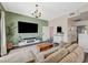 A living room with an accent wall, TV, modern furniture, and great natural light at 9303 Gilcrease Ave # 2234, Las Vegas, NV 89149