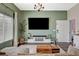 Bright living room featuring modern entertainment center and comfortable seating at 9303 Gilcrease Ave # 2234, Las Vegas, NV 89149