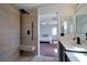 Updated bathroom with tiled shower, single sink vanity, and natural light at 9443 Hot Breeze St, Las Vegas, NV 89178