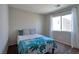 Bright bedroom featuring a comfy bed, large window, and neutral decor at 9443 Hot Breeze St, Las Vegas, NV 89178