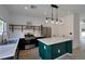 Bright kitchen with stainless steel appliances, island, and modern pendant lighting at 9443 Hot Breeze St, Las Vegas, NV 89178