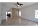 Open living room featuring tile flooring, neutral paint, and contemporary ceiling fan at 9443 Hot Breeze St, Las Vegas, NV 89178