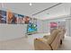 Home movie theater room with reclining seats and media setup at 9742 Toad Hollow St, Las Vegas, NV 89141