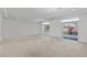 Spacious living room with access to a balcony, offering an adaptable space for relaxation or activities at 9742 Toad Hollow St, Las Vegas, NV 89141