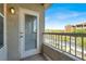 Balcony with railing, offering a view of the community, with a glass door and blind access at 9975 Peace Way # 2009, Las Vegas, NV 89147